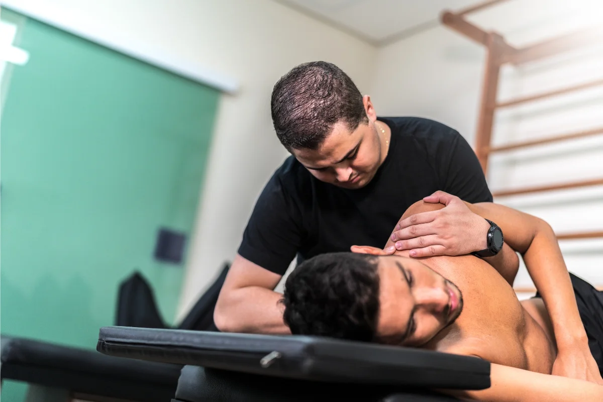Physical therapist providing hands-on joint mobility treatment