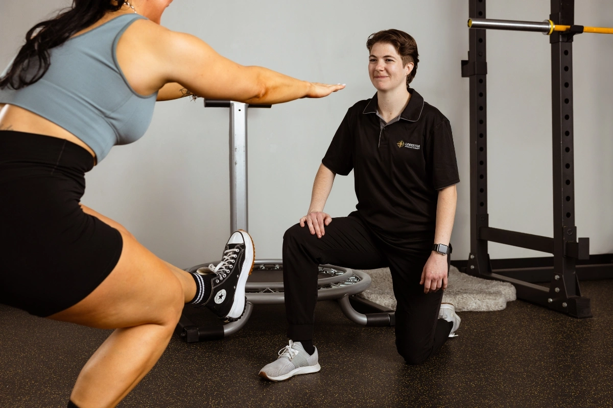 Physical therapist guiding a patient through a one-on-one session